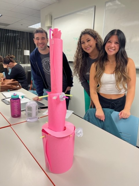 HCOM 520 master students build towers 